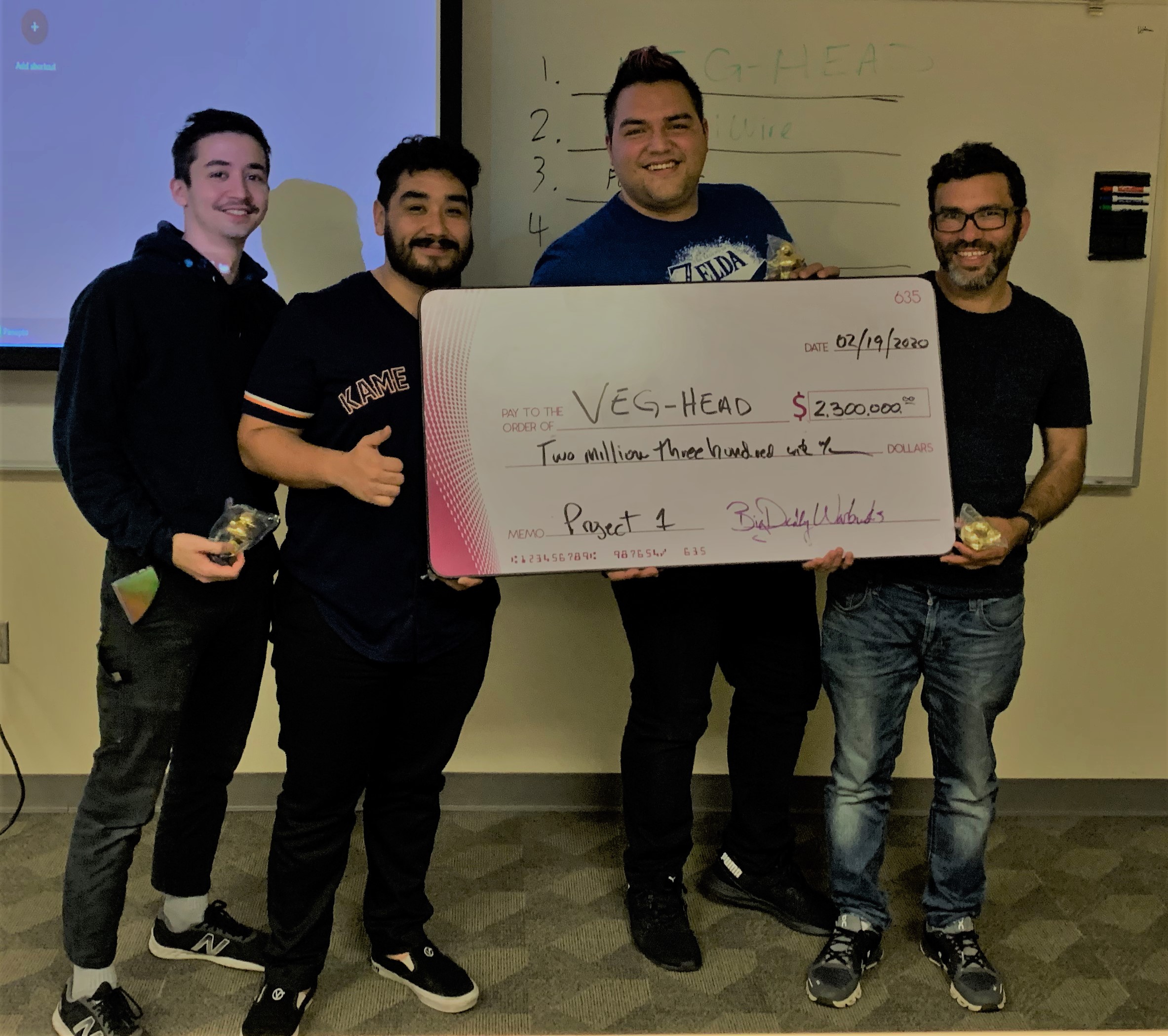 Photo of Mike, Anthony, Alex, and Yarosky holding a check.